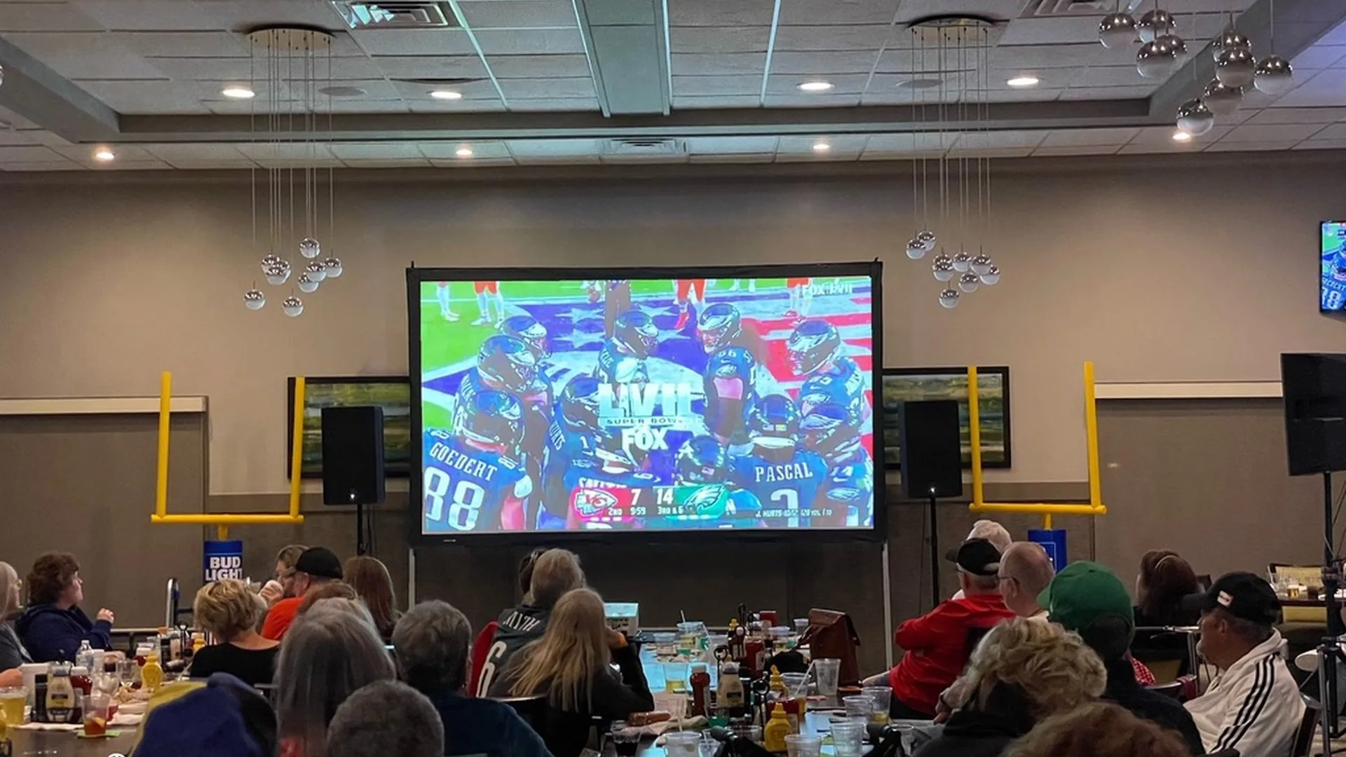 Sports watch party with indoor projection screen