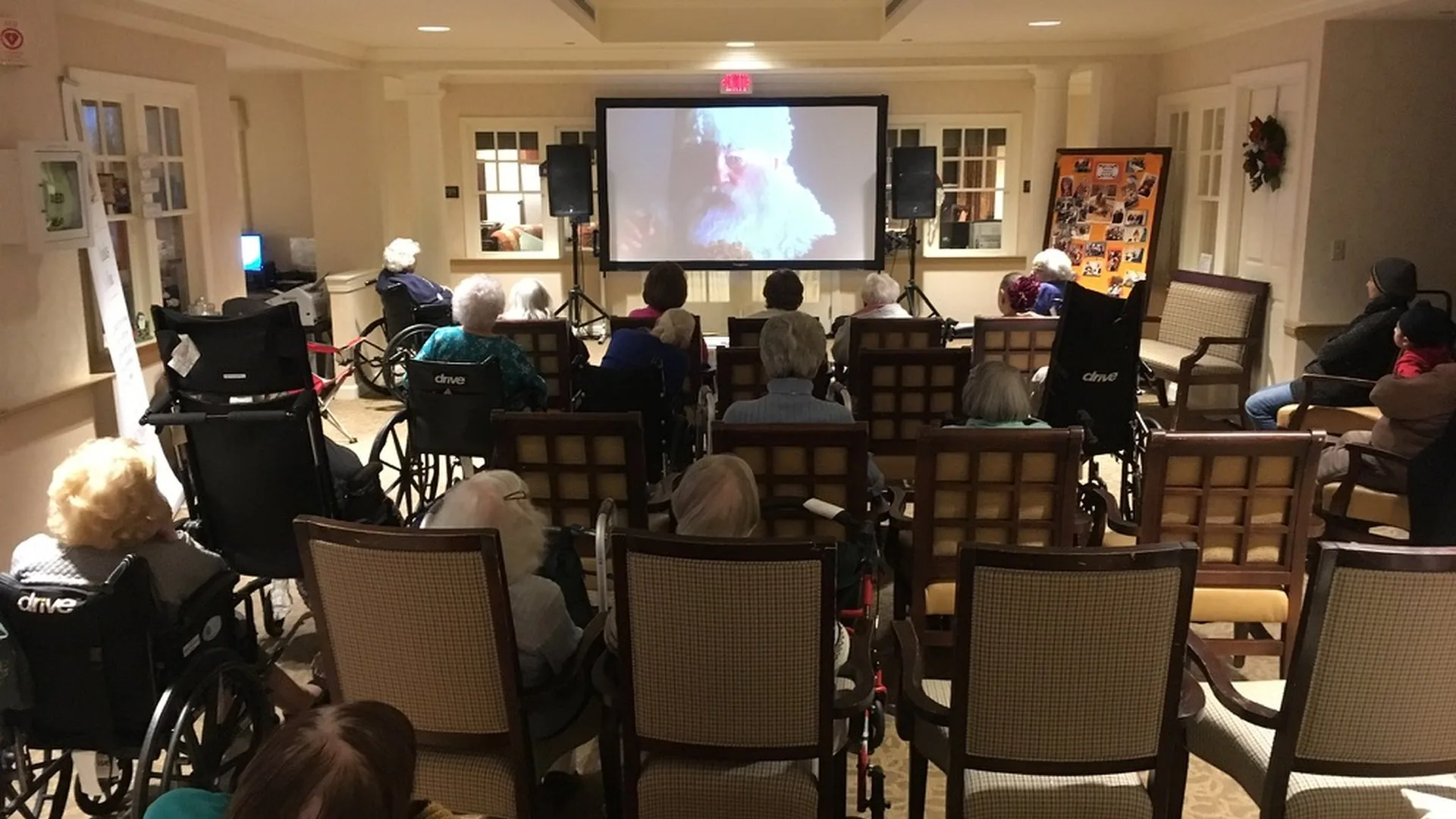 Indoor movie screening at a senior living facility